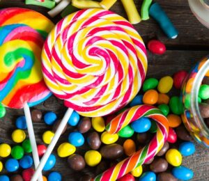 A shot of assorted colorful candy that may contain artificial dyes and additives linked to fossil fuels