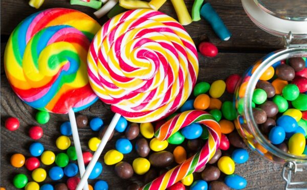 A shot of assorted colorful candy that may contain artificial dyes and additives linked to fossil fuels