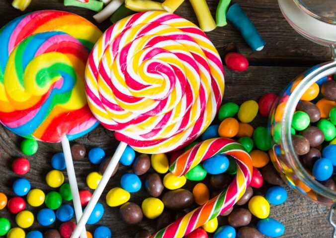 A shot of assorted colorful candy that may contain artificial dyes and additives linked to fossil fuels