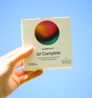 Photo shows someone's hand holding up a packet of supplementV's sV Complete, a vegan all-in-one supplement that the company says is more than just a multivitamin