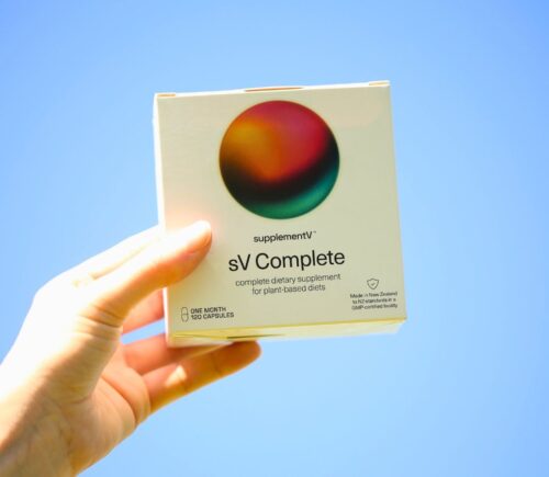 Photo shows someone's hand holding up a packet of supplementV's sV Complete, a vegan all-in-one supplement that the company says is more than just a multivitamin