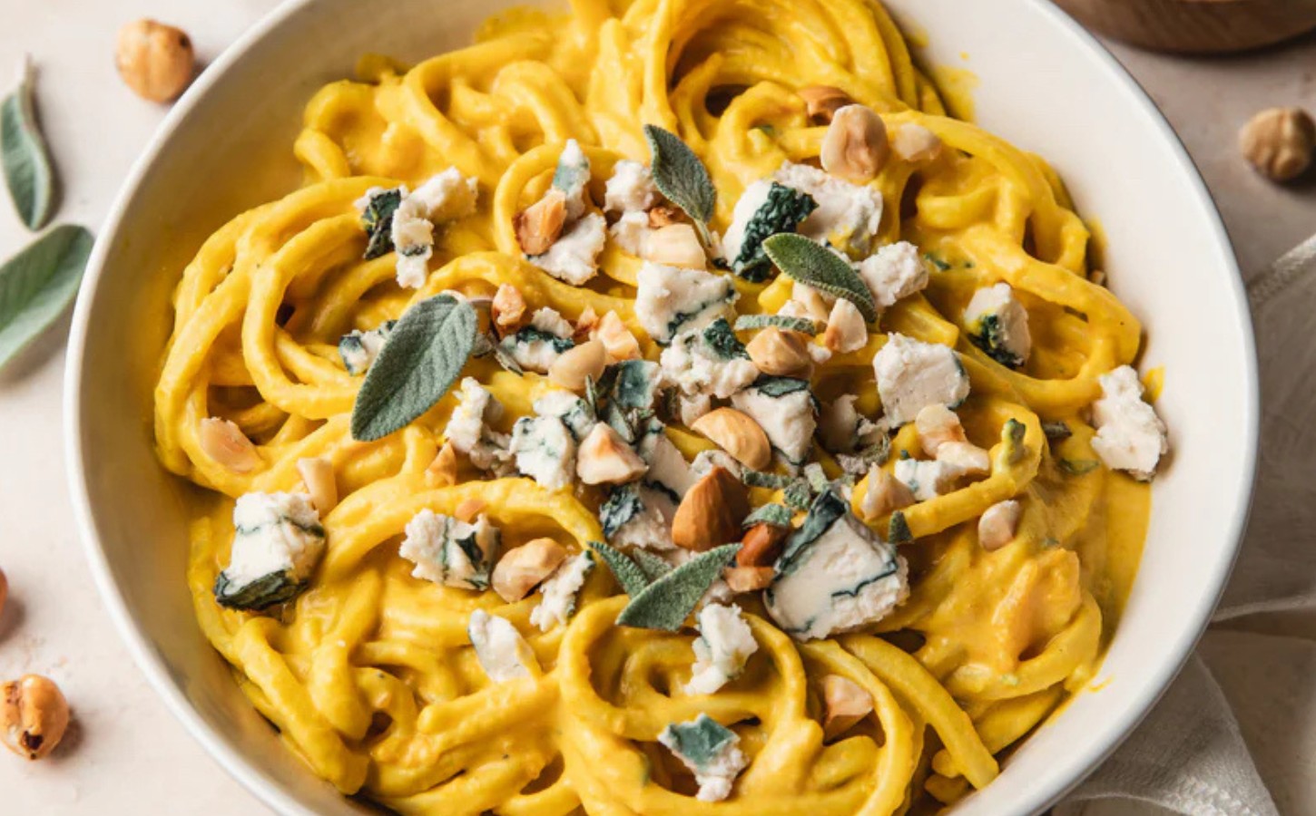 Creamy Squash And Blue Cheese Pasta with vegan blue cheese alternative and hazelnuts