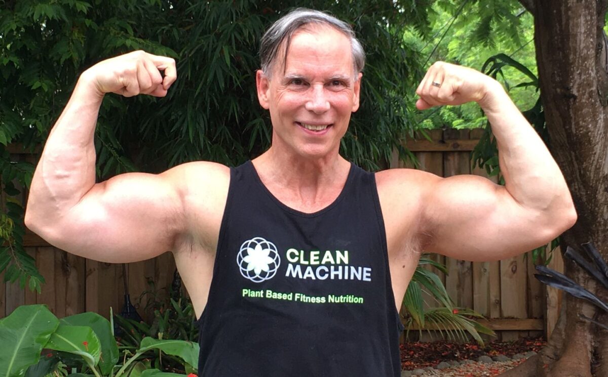 Photo shows Clean Machine founder Geoff Palmer flexing. Could vegans be wasting money on omega-3 DHA supplements and potentially harming their health in the process? Geoff Palmer has spent two decades immersed in omega-3 research, and he says the latest findings are upending old assumptions about how the body metabolizes omega-3s and what that means for human physiology