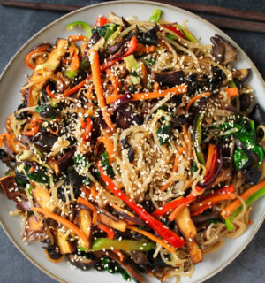 Vegan Japchae (Stir-Fried Glass Noodles) with smoked tofu and veggies