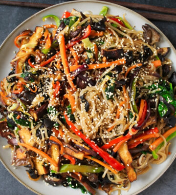 Vegan Japchae (Stir-Fried Glass Noodles) with smoked tofu and veggies