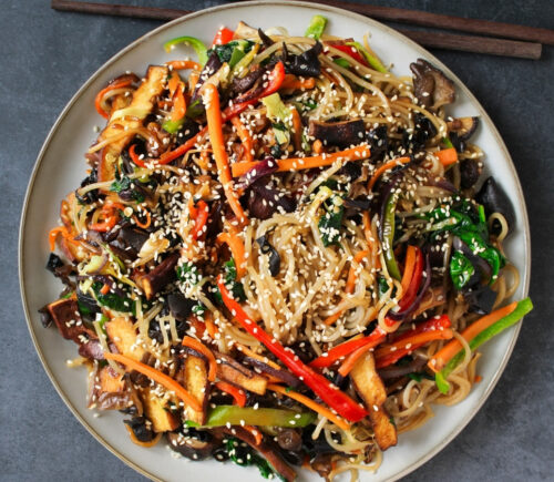 Vegan Japchae (Stir-Fried Glass Noodles) with smoked tofu and veggies