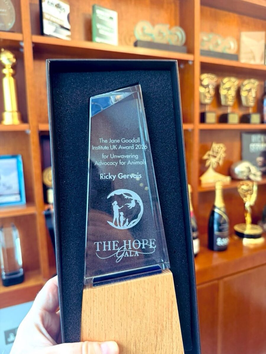 Ricky Gervais has received the Jane Goodall Award for Unwavering Advocacy for Animals. The photo shows  the award as Gervais holds it up in his office