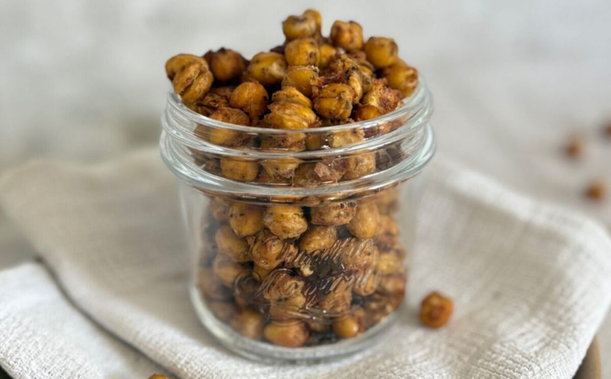 A glass jar of spiced chickpeas for vegan charcuterie
