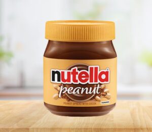 Photo shows a jar of the new Nutella Peanut on a stock kitchen background. To celebrate World Nutella Day, Ferrero finally launched Nutella Peanut, which is both the first vegan Nutella product in North America and an entirely new flavor for the brand