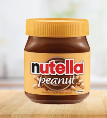 Photo shows a jar of the new Nutella Peanut on a stock kitchen background. To celebrate World Nutella Day, Ferrero finally launched Nutella Peanut, which is both the first vegan Nutella product in North America and an entirely new flavor for the brand