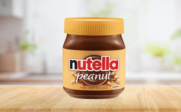 Photo shows a jar of the new Nutella Peanut on a stock kitchen background. To celebrate World Nutella Day, Ferrero finally launched Nutella Peanut, which is both the first vegan Nutella product in North America and an entirely new flavor for the brand