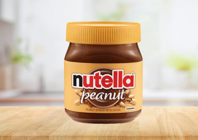 Photo shows a jar of the new Nutella Peanut on a stock kitchen background. To celebrate World Nutella Day, Ferrero finally launched Nutella Peanut, which is both the first vegan Nutella product in North America and an entirely new flavor for the brand