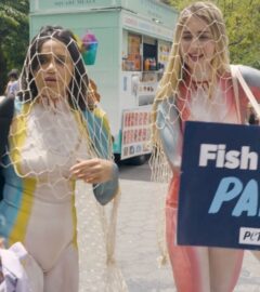 Photo shows a scene from the pilot episode of Green Goddesses Take New York, a reality comedy show from UnchainedTV that follows follows real life friends Justina Adorno and Jamie Logan as they get body-painted as endangered fish and do yoga in Times Square