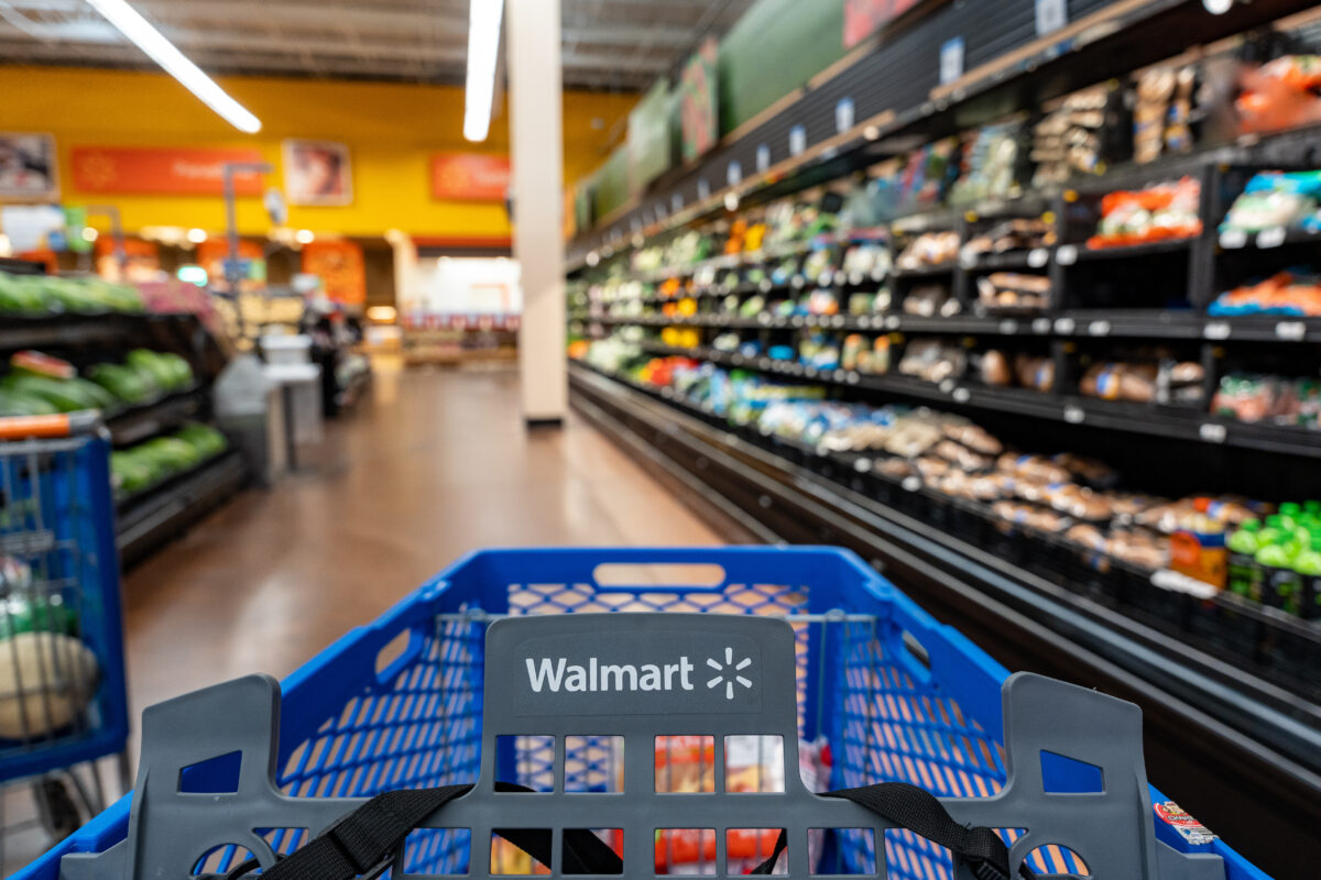 Photo shows a Walmart branded shopping cart in the aisle of a supermarket. A Florida class-action lawsuit is arguing that Walmart’s milk alternatives contain non-plant-based ingredients