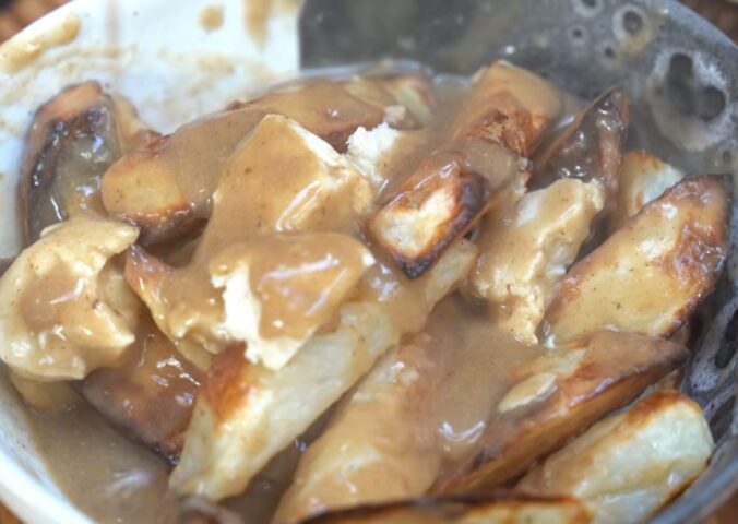 Schinner's vegan poutine recipe yielded this bowl of French fries topped with tofu cheese curds and mushroom gravy