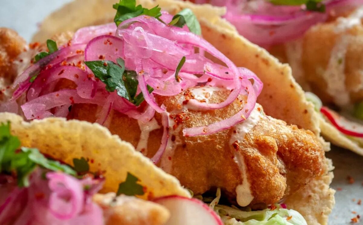 banana blossom tacos with vegan mayo, baja cabbage slaw, and a crispy batter