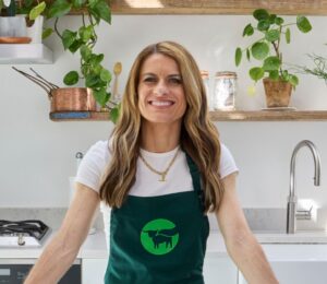 Photo shows Karen Carney, a sports journalist, celebrated footballer, and the winner of last year’s Strictly Come Dancing, in a Beyond Meat apron. Beyond is partnering with Karen Carney on a new UK campaign promoting balanced plant-based eating