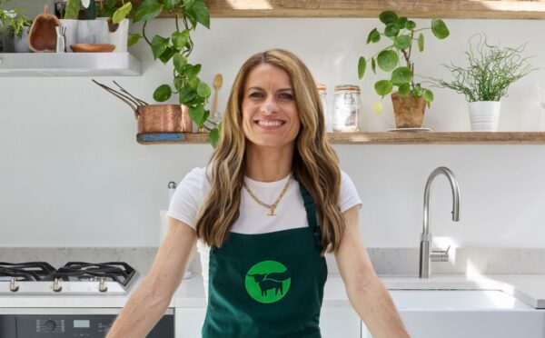 Photo shows Karen Carney, a sports journalist, celebrated footballer, and the winner of last year’s Strictly Come Dancing, in a Beyond Meat apron. Beyond is partnering with Karen Carney on a new UK campaign promoting balanced plant-based eating