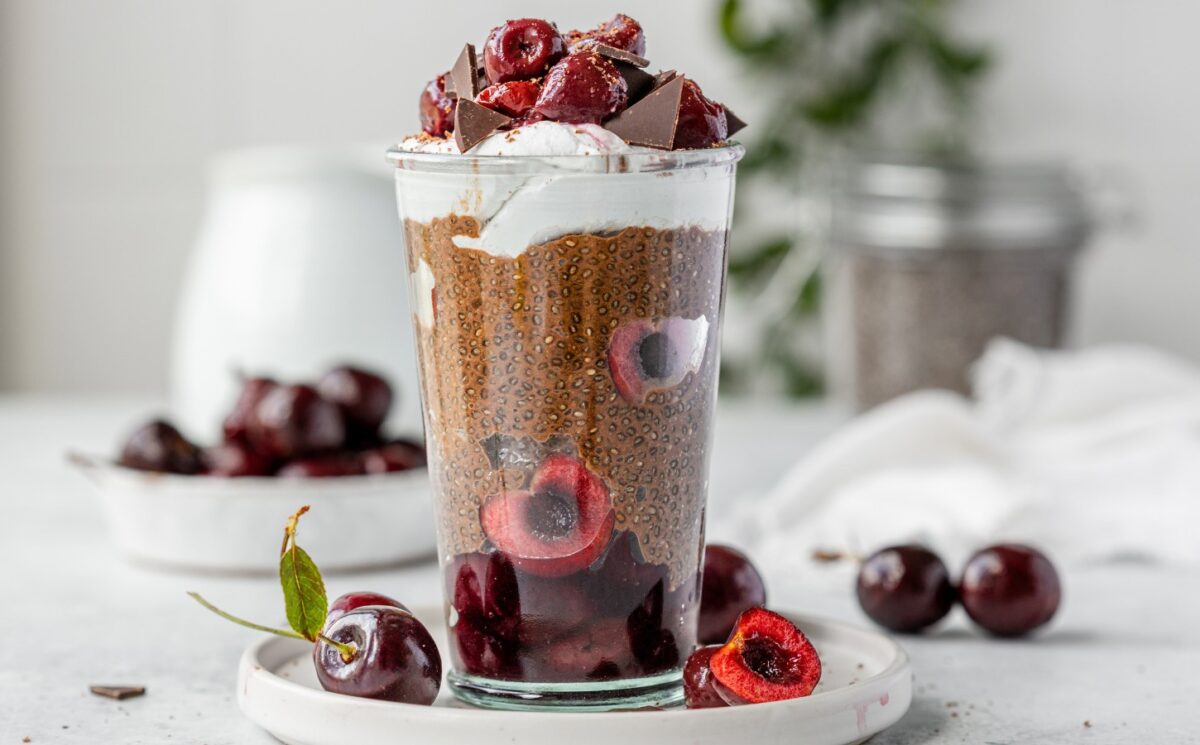 Black Forest Chia Pudding with chocolate shavings and coconut whipped cream