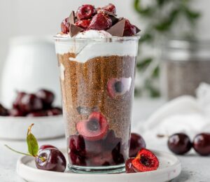 Black Forest Chia Pudding with chocolate shavings and coconut whipped cream