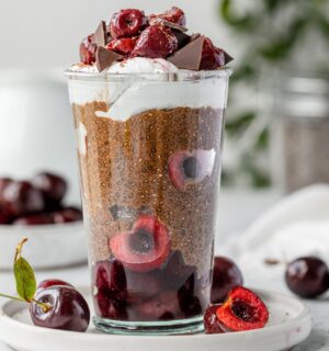 Black Forest Chia Pudding with chocolate shavings and coconut whipped cream