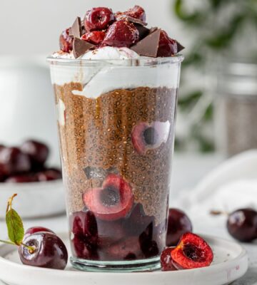 Black Forest Chia Pudding with chocolate shavings and coconut whipped cream