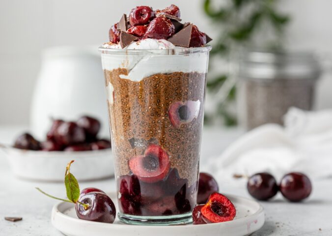Black Forest Chia Pudding with chocolate shavings and coconut whipped cream