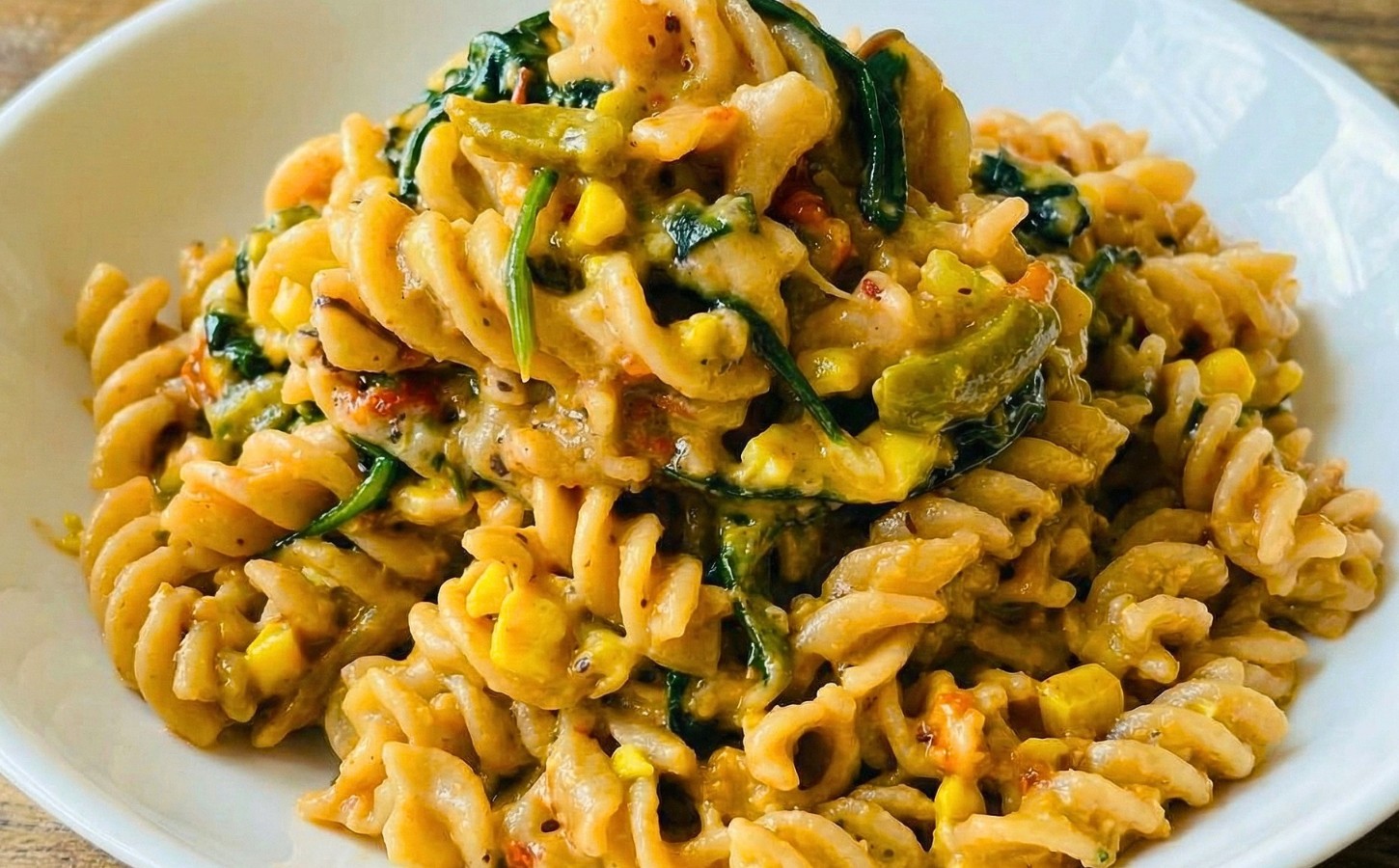 Colorful Vegan Rasta Pasta with bell pepper, ackee, spinach, coconut milk, and more