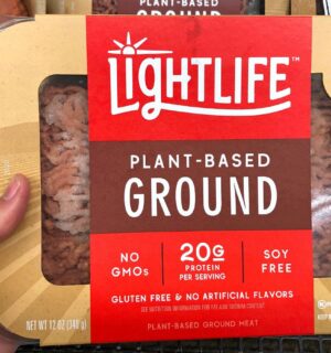 Photo shows someone's hand holding up a packet of plant-based Lightlife mince. The Vegetarian Society's Jenny Canham writes that the labelling of plant-based food is "worth speaking up for"