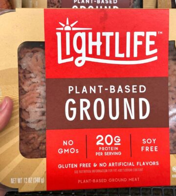 Photo shows someone's hand holding up a packet of plant-based Lightlife mince. The Vegetarian Society's Jenny Canham writes that the labelling of plant-based food is "worth speaking up for"