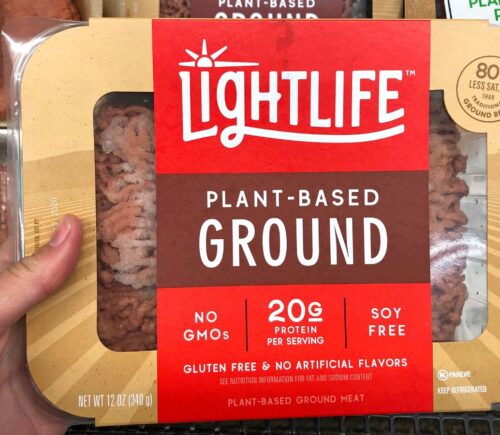 Photo shows someone's hand holding up a packet of plant-based Lightlife mince. The Vegetarian Society's Jenny Canham writes that the labelling of plant-based food is "worth speaking up for"