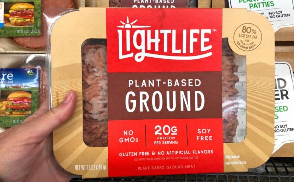 Photo shows someone's hand holding up a packet of plant-based Lightlife mince. The Vegetarian Society's Jenny Canham writes that the labelling of plant-based food is "worth speaking up for"