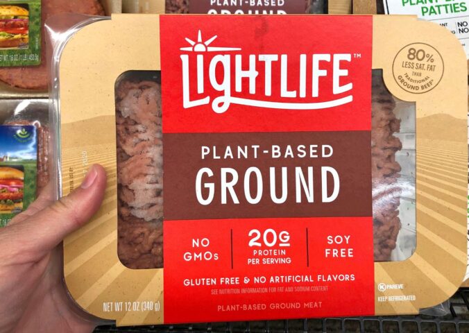 Photo shows someone's hand holding up a packet of plant-based Lightlife mince. The Vegetarian Society's Jenny Canham writes that the labelling of plant-based food is "worth speaking up for"