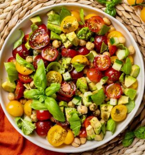 Fresh Cherry Tomato And Chickpea Salad with cucumber, avocado, basil, and lemon