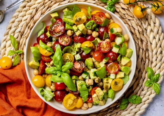 Fresh Cherry Tomato And Chickpea Salad with cucumber, avocado, basil, and lemon