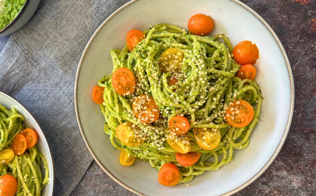 wild garlic and edamame pesto pasta with cherry tomatoes and hemp hearts for quick vegan summer lunch ideas