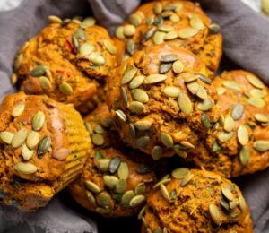 Savory Eggy Breakfast Muffins with flax, nutritional yeast, chickpea flour, corn, and pumpkin seeds on top