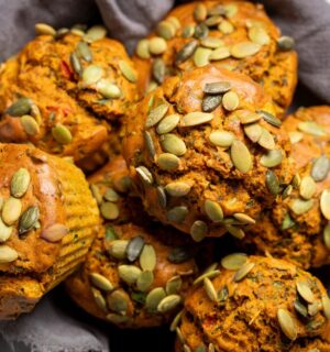 Savory Eggy Breakfast Muffins with flax, nutritional yeast, chickpea flour, corn, and pumpkin seeds on top
