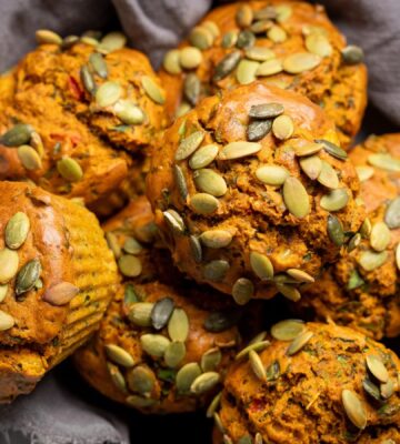 Savory Eggy Breakfast Muffins with flax, nutritional yeast, chickpea flour, corn, and pumpkin seeds on top