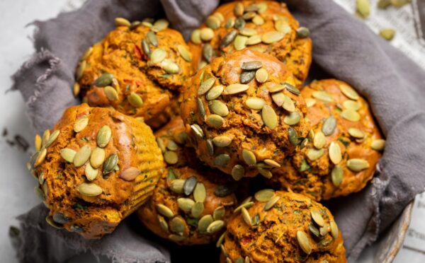 Savory Eggy Breakfast Muffins with flax, nutritional yeast, chickpea flour, corn, and pumpkin seeds on top