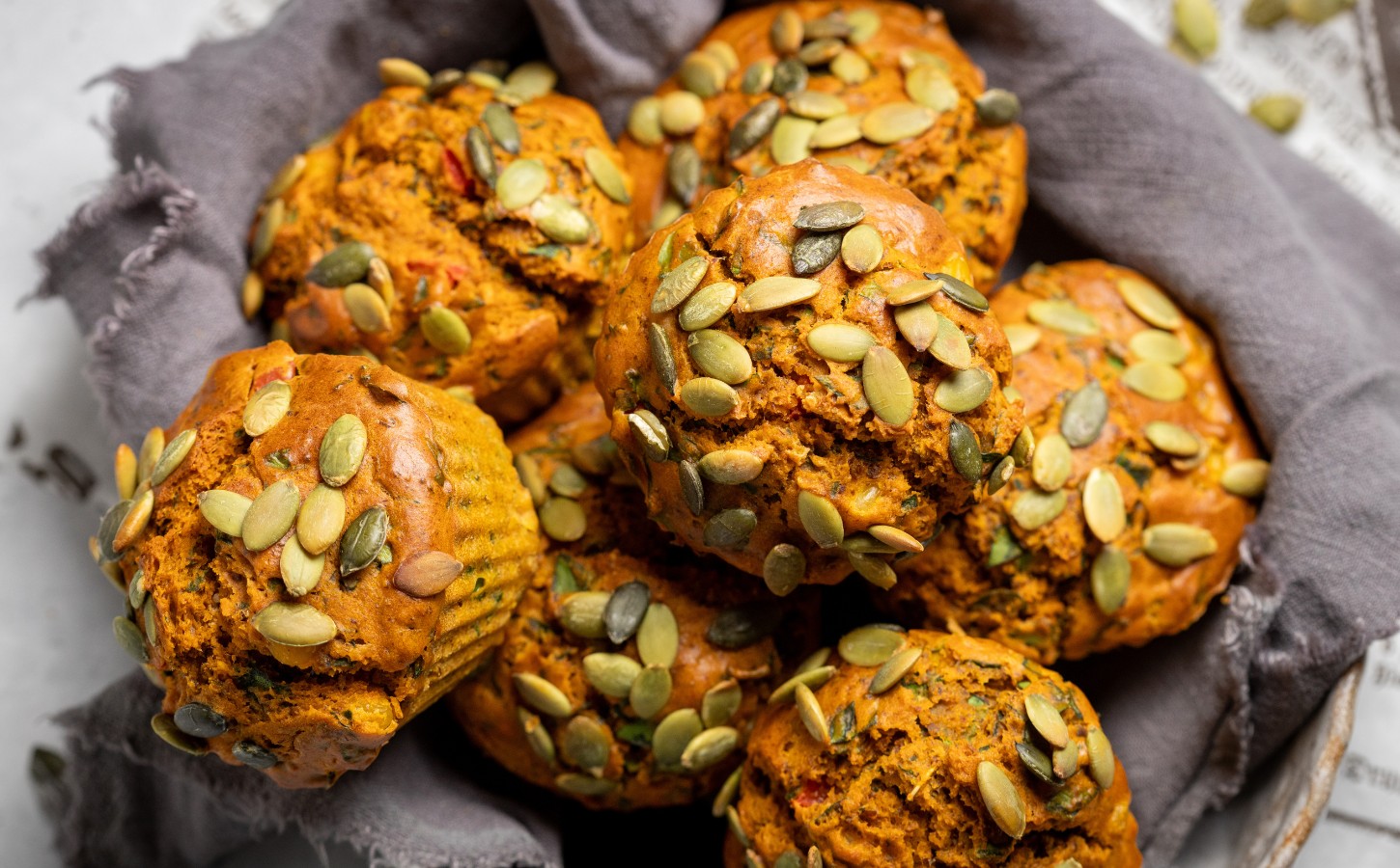 Savory Eggy Breakfast Muffins with flax, nutritional yeast, chickpea flour, corn, and pumpkin seeds on top