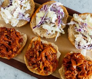 smoky BBQ shredded jackfruit on sliders with coleslaw for plant-based BBQ recipes