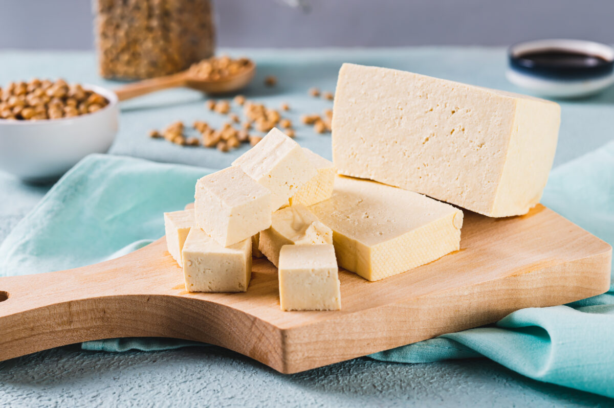 Photo shows a block of tofu on a wooden chopping board. Soy and legumes really can help to lower hypertension risk, according to a new study