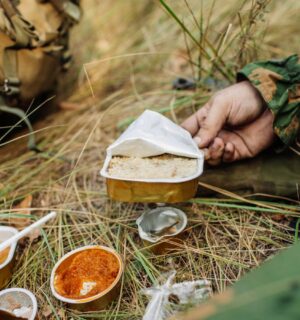 Photo shows soldiers sharing military rations on a small stove. The US Army is looking for new alternative proteins and plant-based meat products to put in soldiers' rations