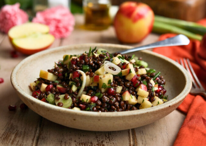 vegan apple summer salad with pomegranate, lentils, and mint