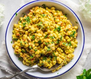 Vegan Curried Chickpea Salad with red onion, celery, red pepper, mayo, lemon, and curry powder