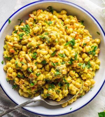 Vegan Curried Chickpea Salad with red onion, celery, red pepper, mayo, lemon, and curry powder