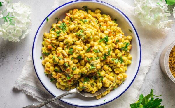 Vegan Curried Chickpea Salad with red onion, celery, red pepper, mayo, lemon, and curry powder
