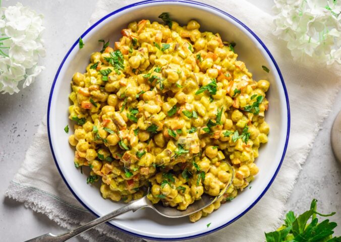 Vegan Curried Chickpea Salad with red onion, celery, red pepper, mayo, lemon, and curry powder