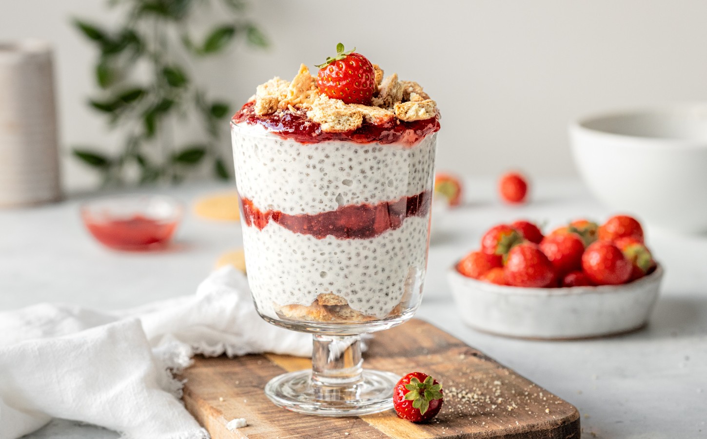 Strawberry Cheesecake Chia Pudding with coconut milk, cashews, vanilla, digestives, and strawberry compote